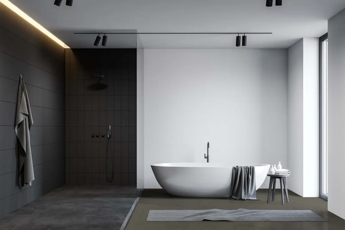 Ducha con pavimento de microcemento de tonalidad gris profundo. Ducha con pavimento de microcemento de tonalidad gris profundo.